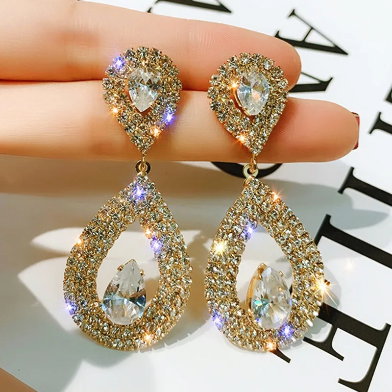 

Korean-designed pave-set diamond teardrop drop earrings Elegant and sophisticated for weddings and formal occasions