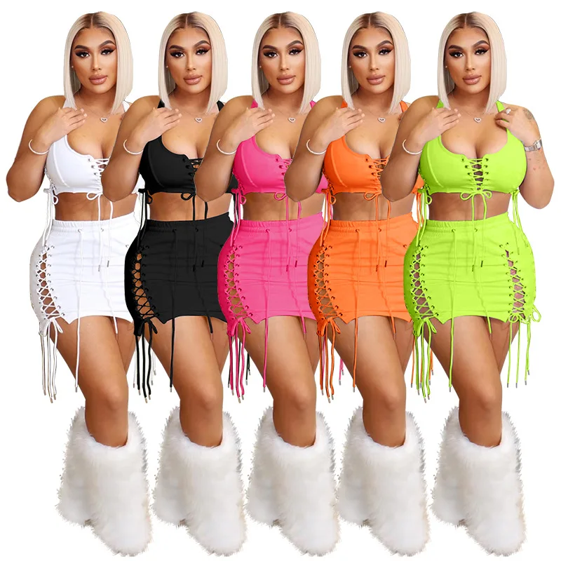 

Hollow Out Grommet Lace Up Skirts 2 Piece Set Women Summer Sexy Bandage Tank Crop Top + Mini Skirts Skinny Club Rave Outfits