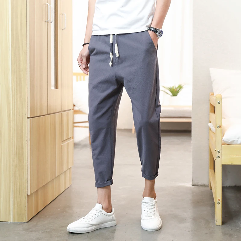 بنطلون رجالي صيفي من القطن والكتان بقصة ضيقة وخفيف الوزن بطول تسعة أرباع، بنمط الشباب الحيوي وخصر متوسط بلون واحد