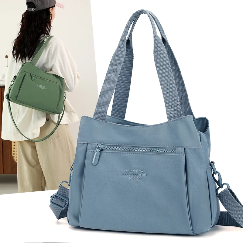 

Waterproof Nylon Canvas Travel Bag 2025 New Casual Versatile Large Capaci Lightweight oulder Handbag for Women