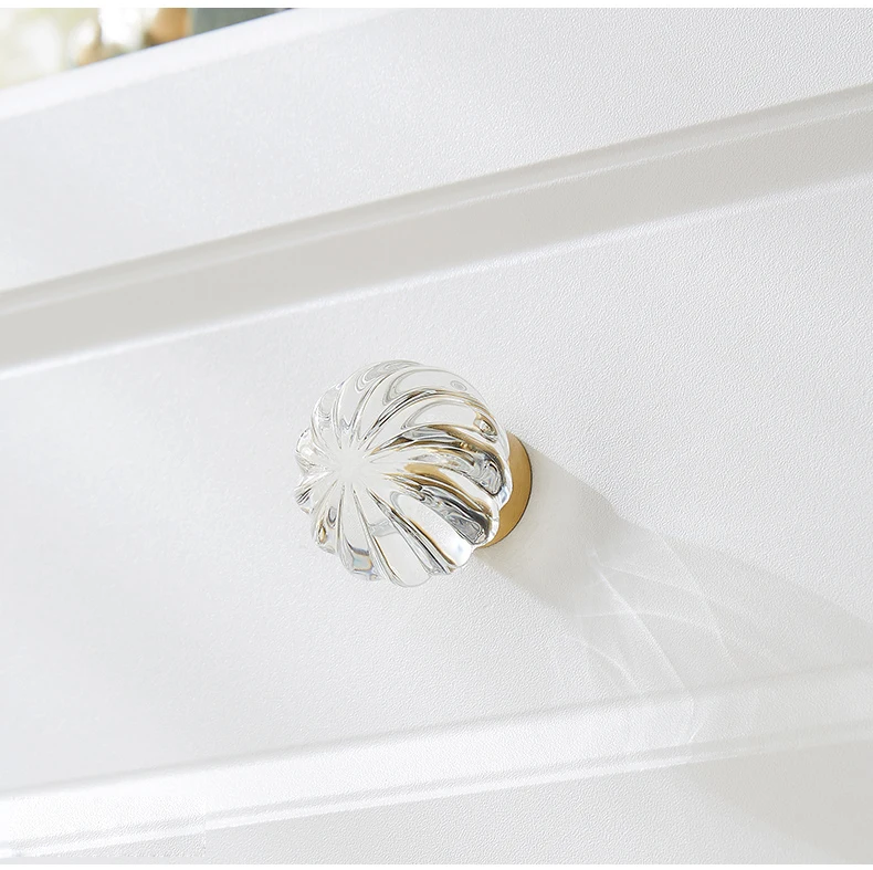 Clear round ribbed furniture knob with brass base