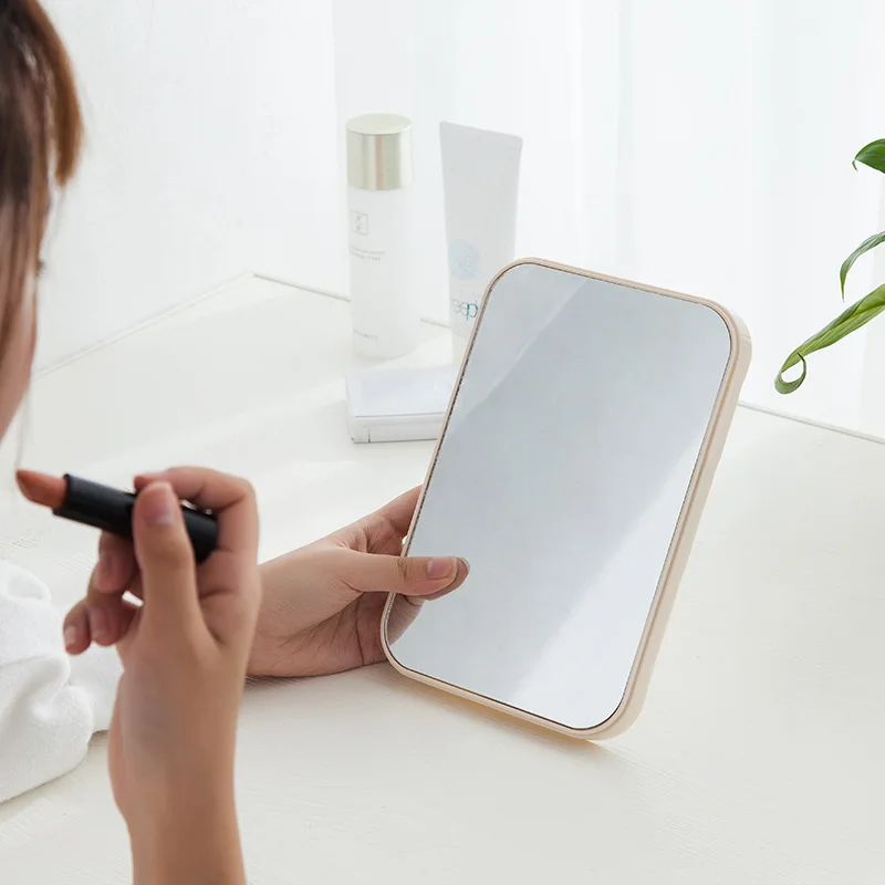 Handheld Makeup Mirror for Travel and On-The-Go Touch Ups with Folding Stand