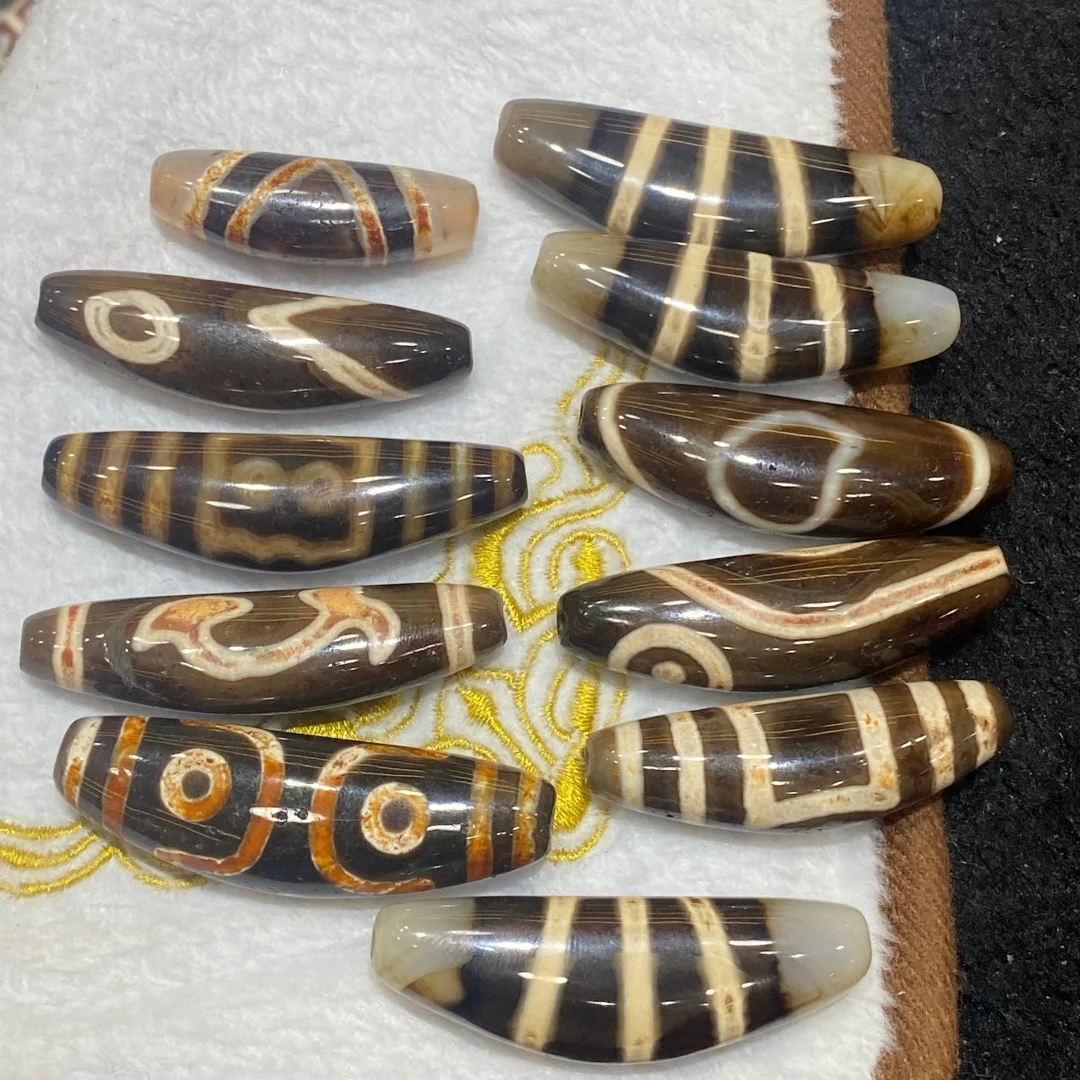 1pcs/lot High-quality Taiwanese craftsmanship jade-like brown clear cow horn-shaped Dzi 45-53mm money groove  Ruyi design