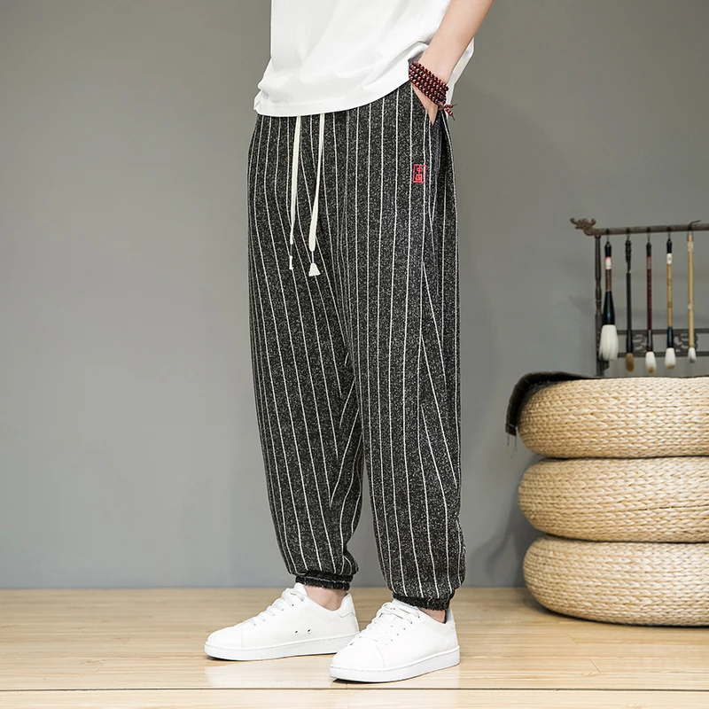 Pantalones de verano de primavera para hombres cómodos y transpirables de algodón y lino pantalones casuales moda raya pantalones harem hombre