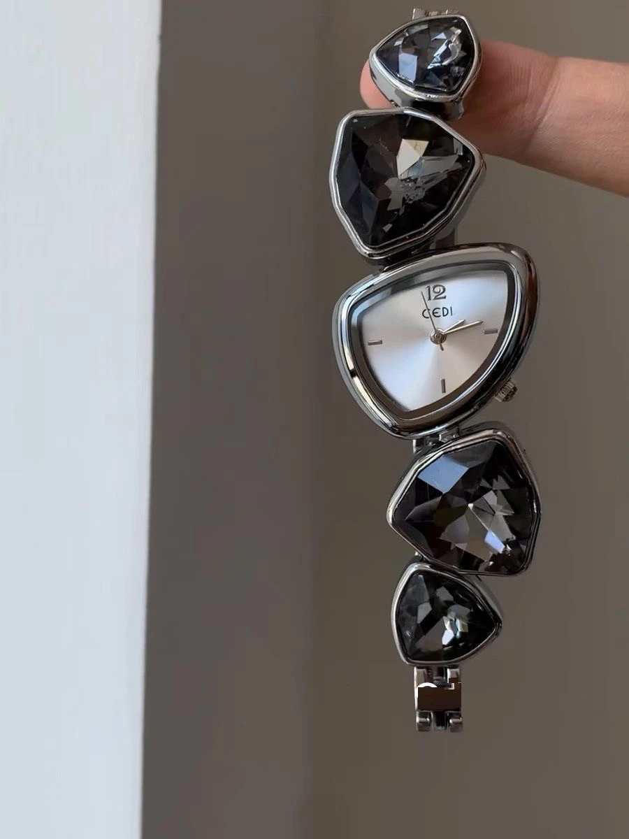 

Elegant women's wristwatch, black crystal design, stylish and sophisticated quartz watch for women, high-quality timepiece.