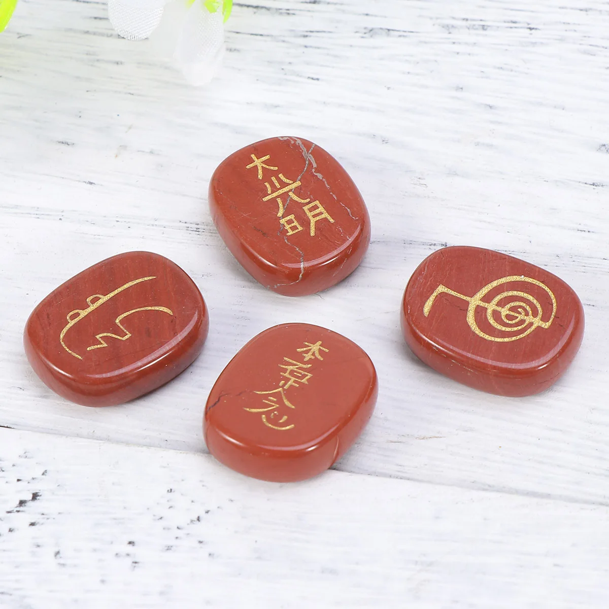 

Red Chakra Gemstone Palm Stone Engraved with Golden Symbols for Healing Meditation and Spiritual Energy Work