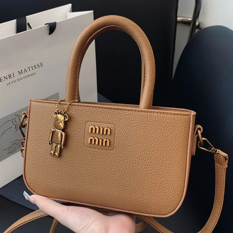 This year's fashion trend is high-end hand-held small bags for women 2025 new simple hand-held shoulder crossbody bags and small