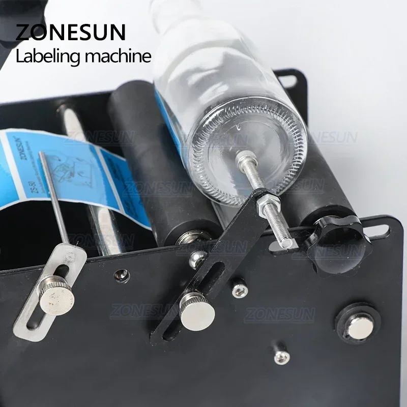 ZONESUN Manual Labeling Machine With Handle Label Applicator Metal Round Bottle Packing Machine Bottle Labeler ZS-50P