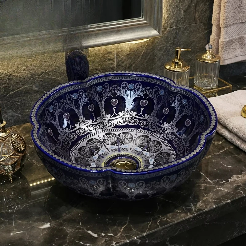 Luxury blue ceramic bathroom basin, elegantly decorated washbasin