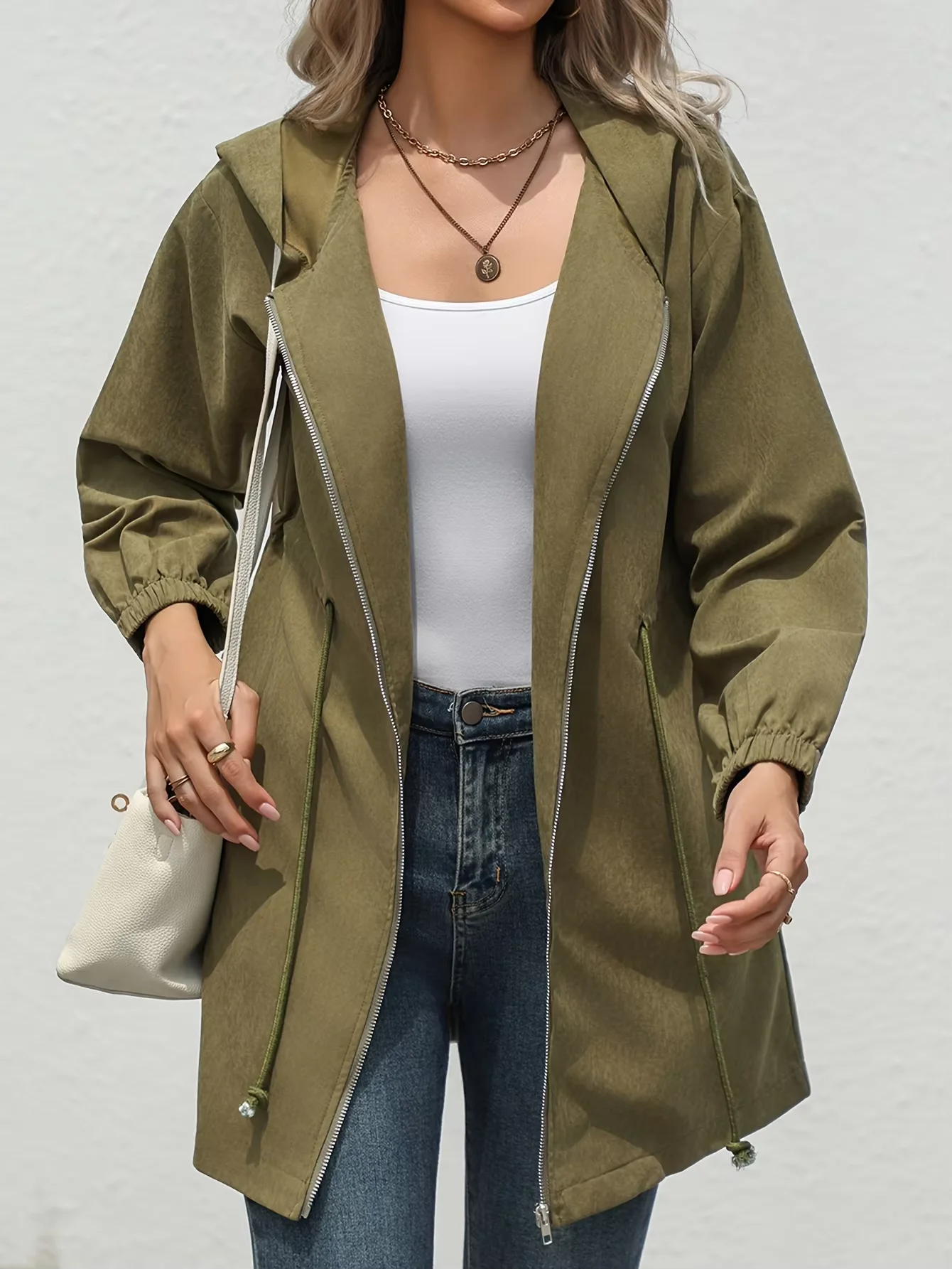 A new autumn and winter fashion mid-length jacket with a cinched waist and a hood for young girls in Europe and America