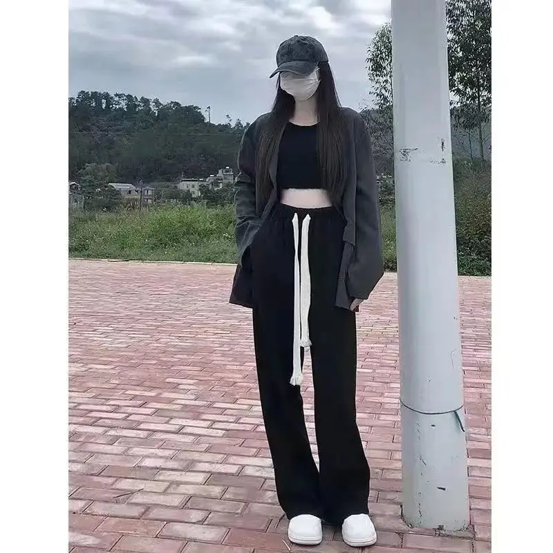 بنطال ذو قصة أرجل واسعة للنساء صيفي رفيع للغاية مثقوب مفرغ واسع الأرجل مقسم محب ناعم مطابق للتهوية قابل للتمدد 2025