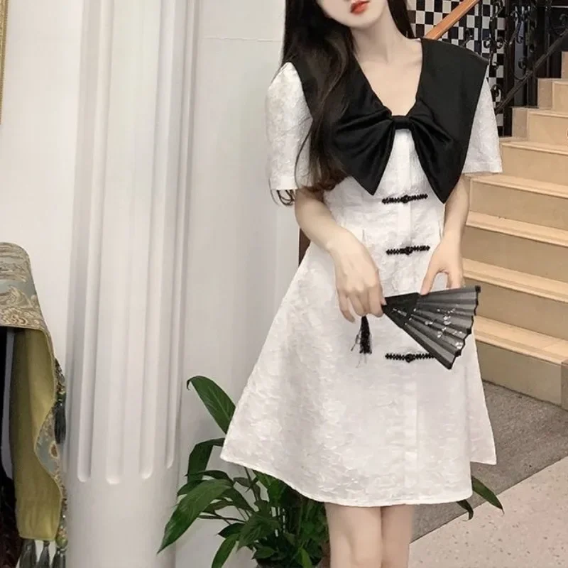 Japanese Lolita 2024 Summer New Pullover Doll Neck Spliced Bow Button Solid Color Fashion Slimming Casual Short Sleeved Dress