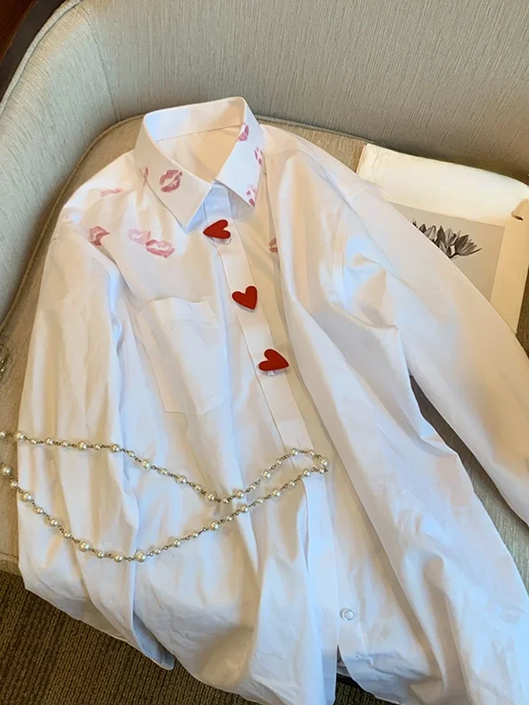 Camisa con solapa para hombre y mujer, camisa de manga larga con estampado de corazón y botones, color blanco, Harajuku, 2024