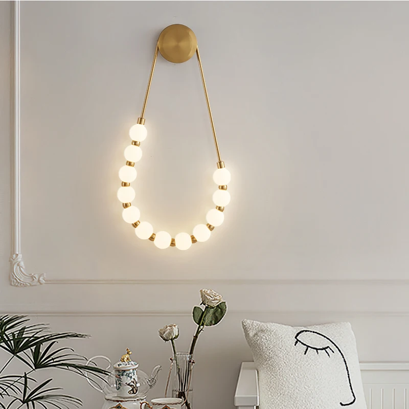 Modern simple bedroom bedside lamp Italian cream style living room creative design Asymmetric magic bean wall lamp