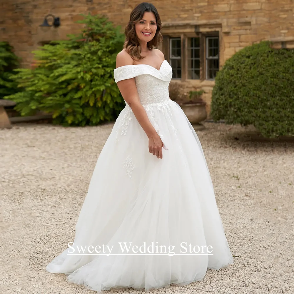 فستان زفاف مقاس كبير من Vestido De Noiva مخصص قبالة الكتف ورقبة على شكل V مزين بالترتر من التل على شكل حرف A فستان زفاف العروس