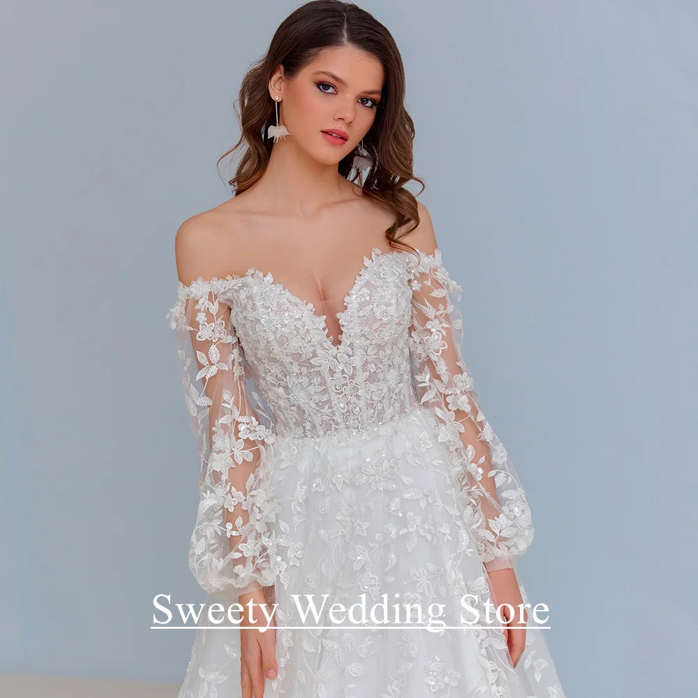 فساتين زفاف دانتيل رائعة مخصصة بأكمام منتفخة ورقبة على شكل V سويب تراين تول لامع مشد فستان زفاف للعروس