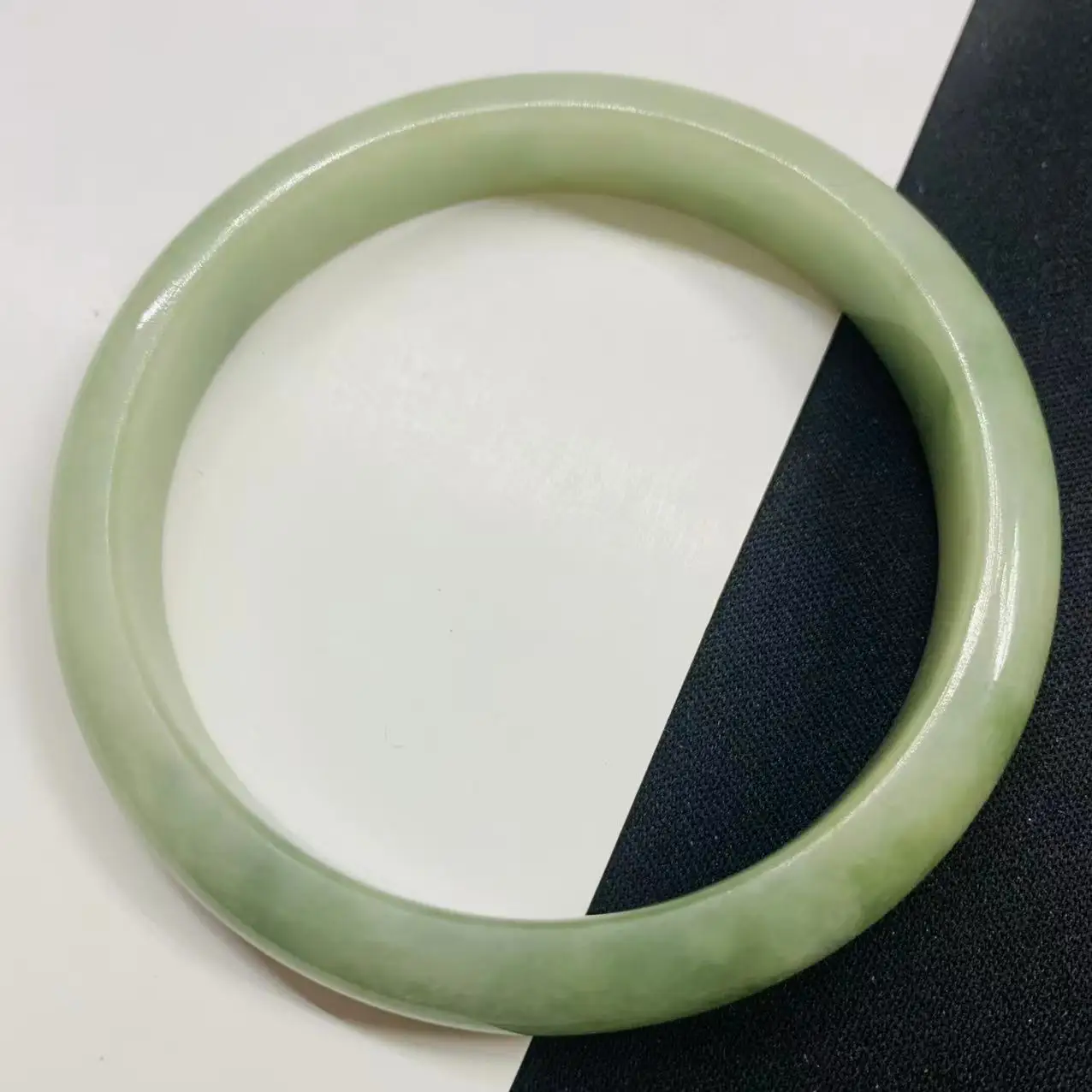 

58.2mm light green jadeite bracelet photographed in real life