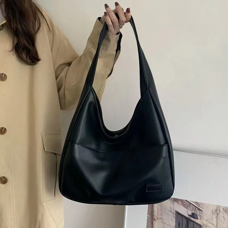 Large capacity tote bag, new black leather simple casual commuting women\'s bag, fashionable and versatile single shoulder bag