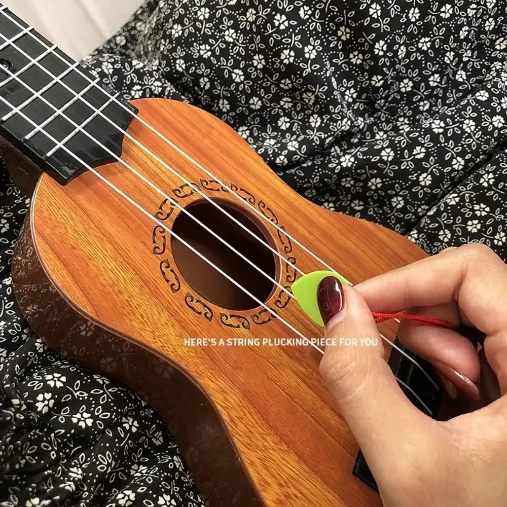 4 corde Ukulele Strumento musicale Giocattolo Yukrili Giocattoli Simulazione classica Ukulele Giocattolo Giocabile Manopola a corda regolabile