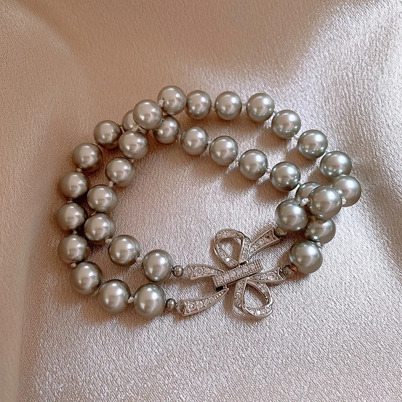 

Exquisite Fashion Bow Gray Imitation Pearl Buckle Bracelet for Women 2025 New Stainless Steel Luxury Jewelry Bracelet Gift