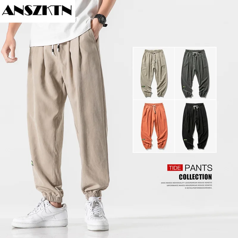 

ANSZKTN Men's summer pants 2022 Korean edition breathable small feet nine points sports overalls fashion brand foot band fashion