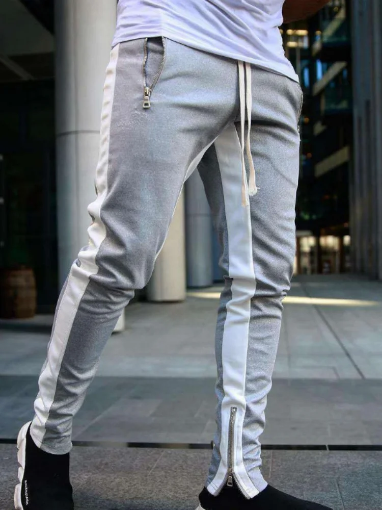 

Модные спортивные бегуны на молнии для женщин и мужчин. Функциональные и стильные повседневные брюки для отдыха.