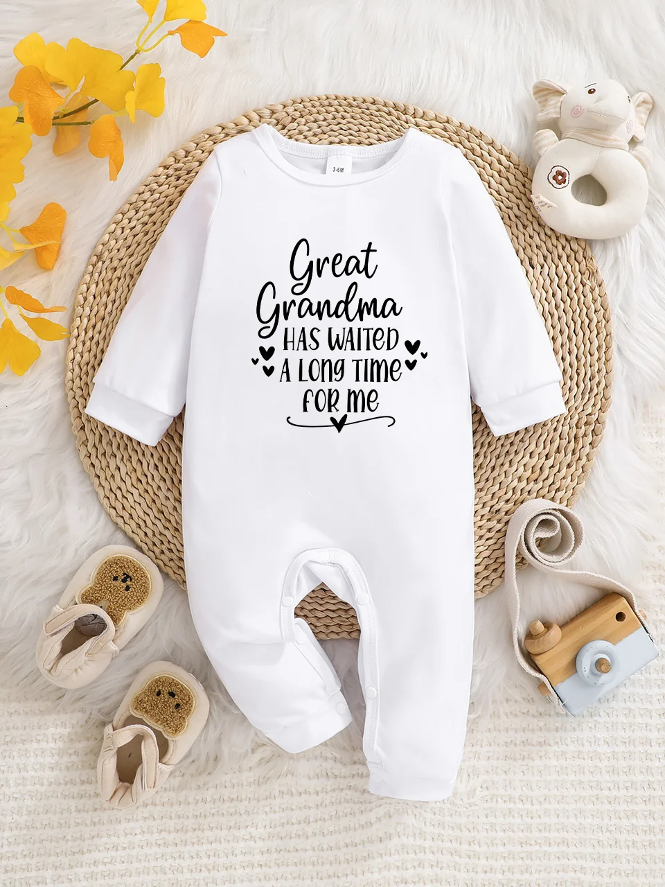 Baby long-sleeved bodysuit with fun letter prints, button design, easy care, suitable for new parents.