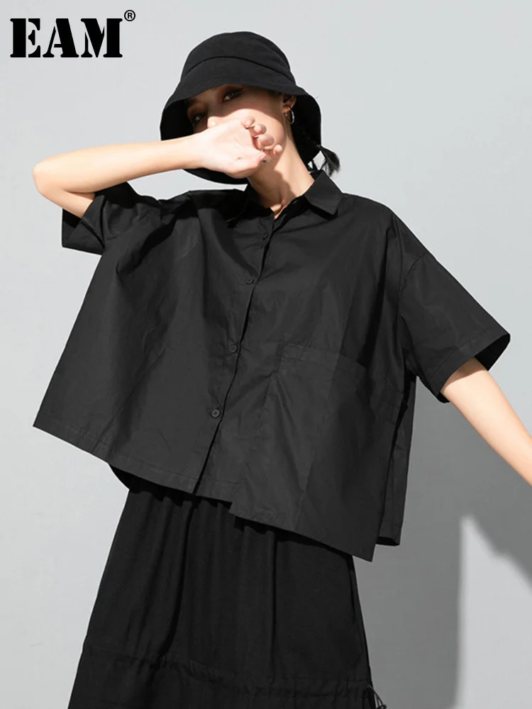 [EAM] Women Black Big Size Irregular Pocket Blouse New Lapel Short Sleeve Loose Fit Shirt Fashion Spring Summer 2025 1DD8088