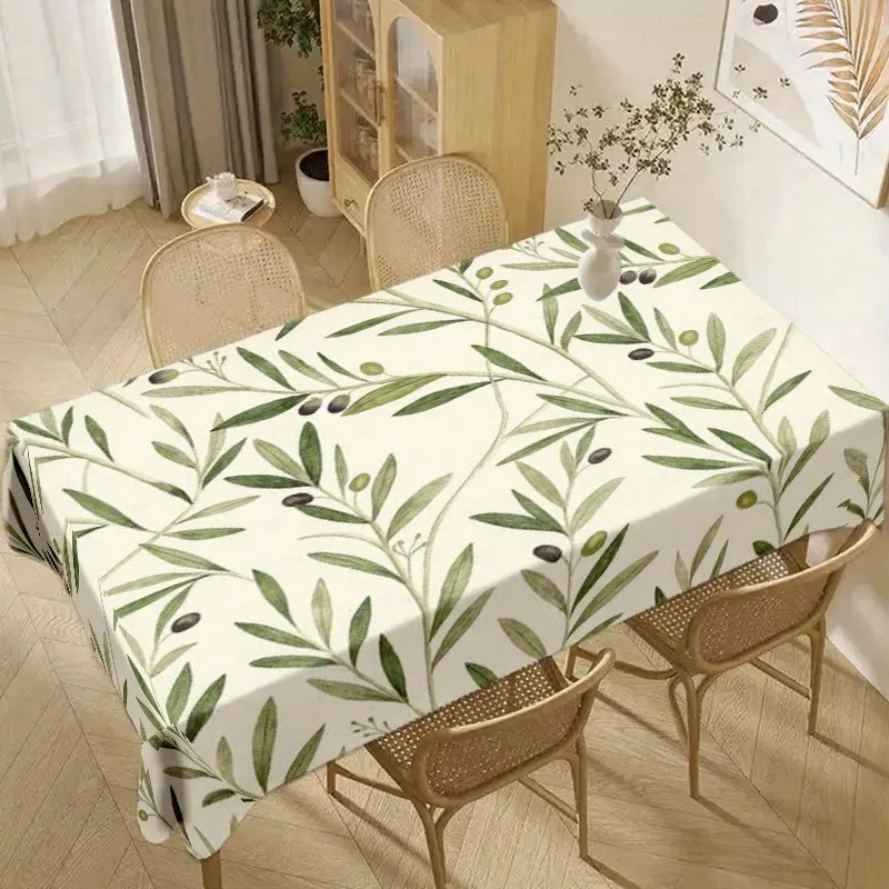 The fashionable soft printed tablecloth is decorated with olive branches and leaves patterns.