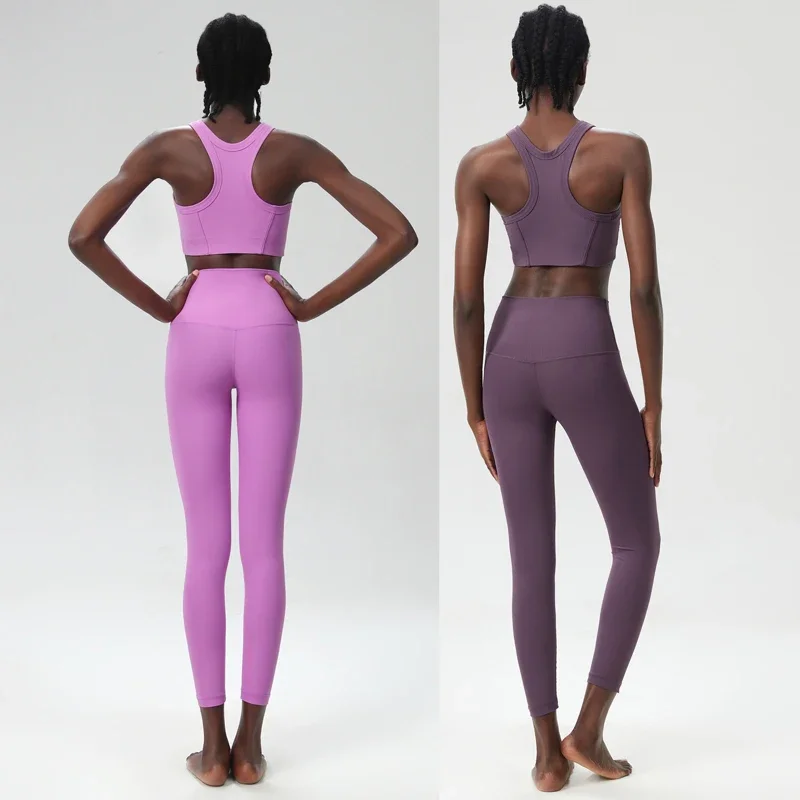 ชุดออกกำลังกายโยคะสองชิ้นสำหรับผู้หญิง สีพื้น ผ้าริบ ชุดออกกำลังกายแบบกระชับรูป ระบายอากาศได้ดี เหมาะสำหรับวิ่งและเล่นกีฬา ชุดออกกำลังกายสำหรับผู้หญิง