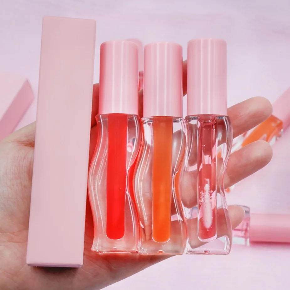 Gros marque privée maquillage végétalien Logo personnalisé huile pour les lèvres fruitée repulpante conception ondulée brillant hydratant brillant Non collant brillant à lèvres