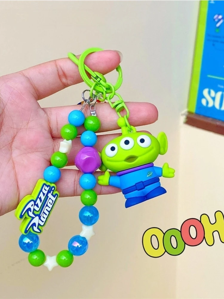 Toy Story – porte-clés de voiture en perles à trois yeux pour hommes et femmes, pendentif de sac à dos exquis, accessoires d'appareil photo, pendentif d'écouteurs