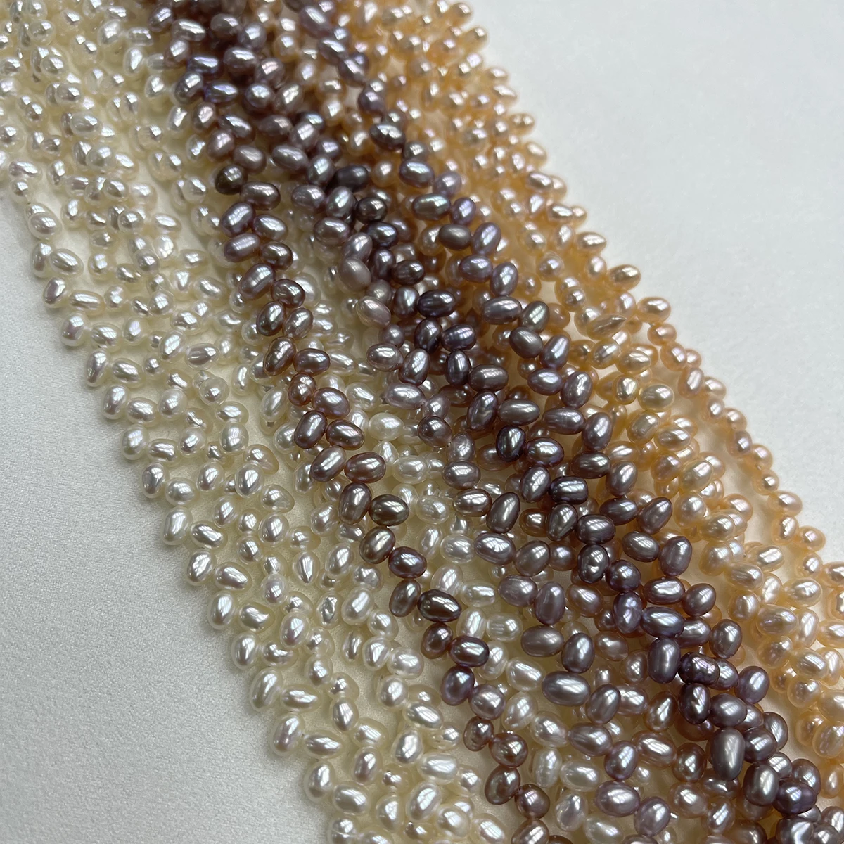 

Factory Wholesale 4-5mm Natural Freshwater Pearl Three-hole Wheat-ear Bead Oval Bead for DIY Necklace Bracelet Jewelry Making