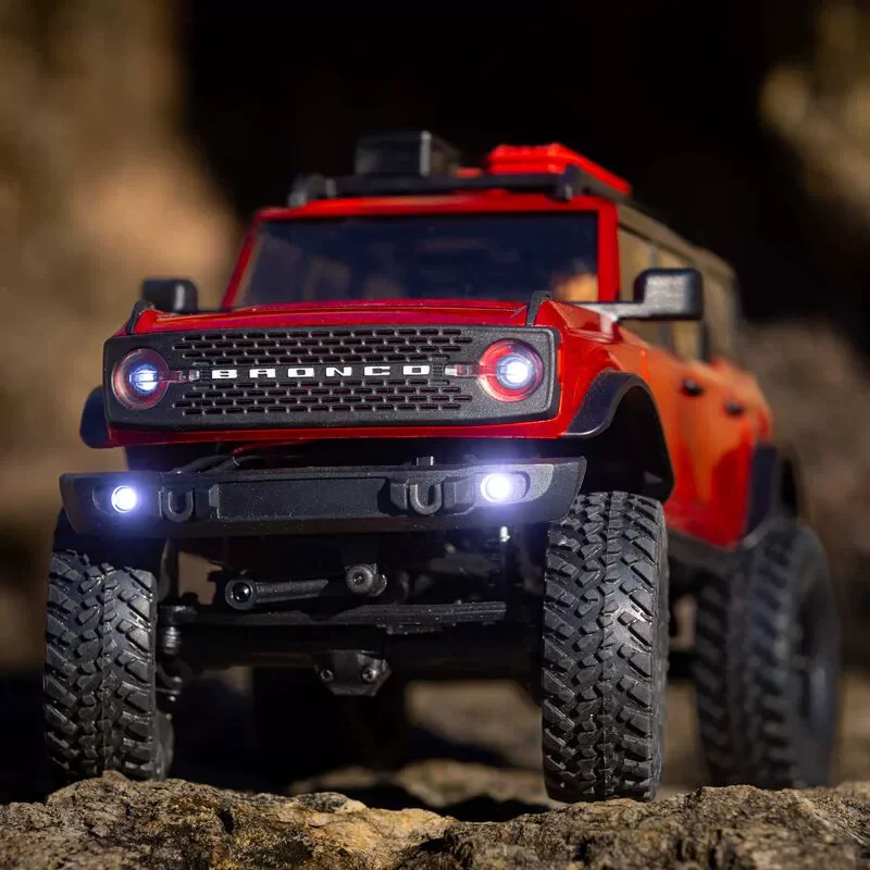 محوري 1/24 فورد برونكو Scx24 مركبة تسلق كهربائية يتم التحكم فيها عن بعد على الطرق الوعرة محاكاة السيارة