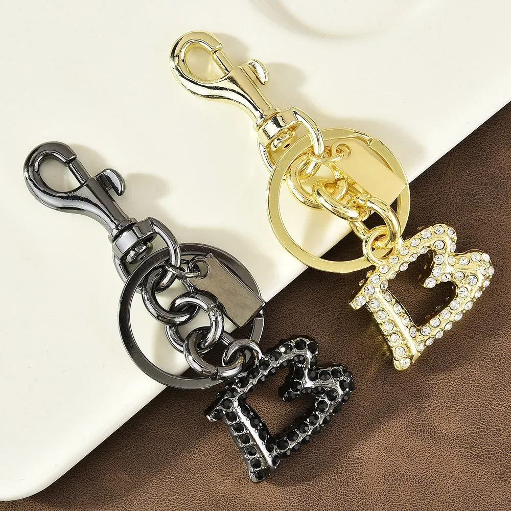 998Hot nowy metalowy, wysadzany diamentami, stylowy wisiorek do torby z angielską literą, brelok, modny i spersonalizowany wisiorek