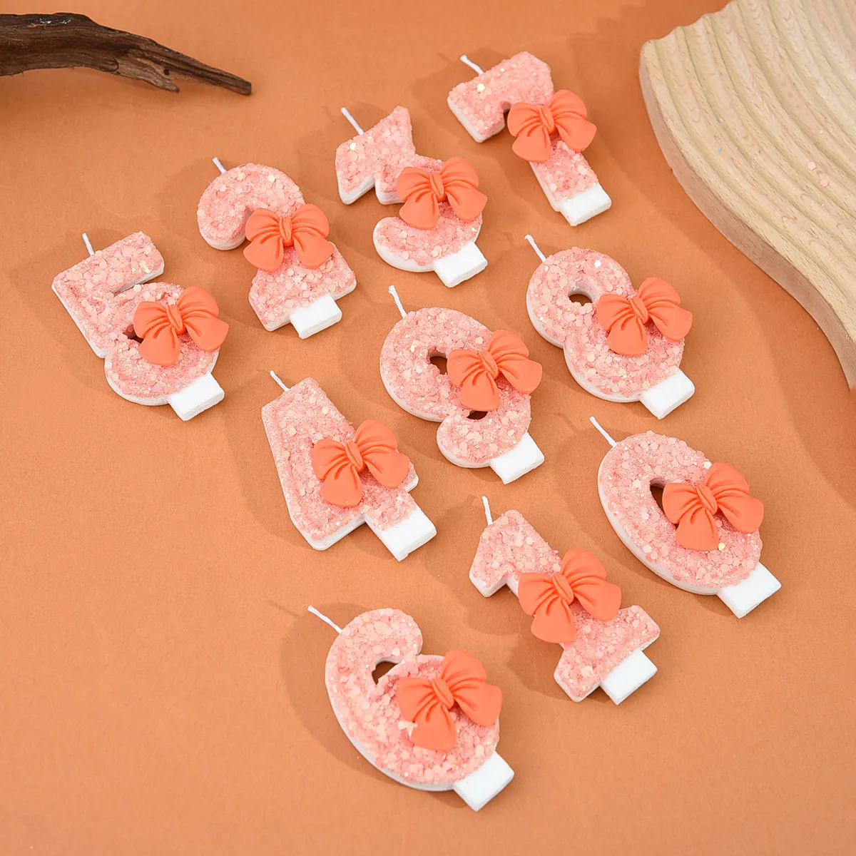 Peach powder sequin three-dimensional orange bow digital candle, suitable for party gifts, birthdays and anniversaries.