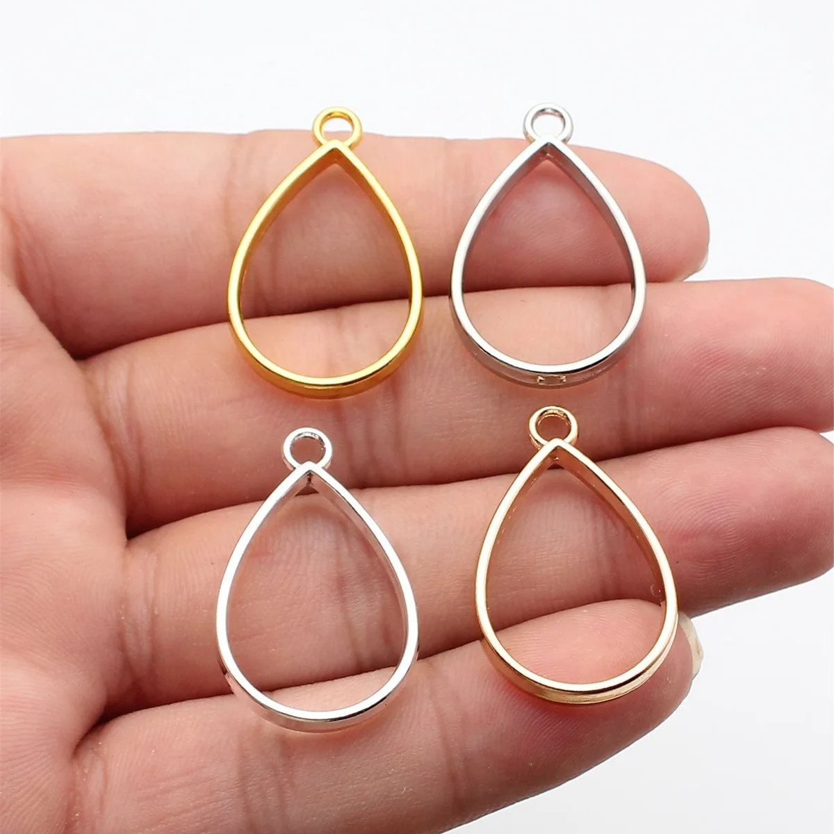 WYSIWYG 10pcs 33x20x3.7mm 4 Colors Hollow Geometric Glue Frame Series Water Drop Shaped Border Frame Jewelry Making Findings