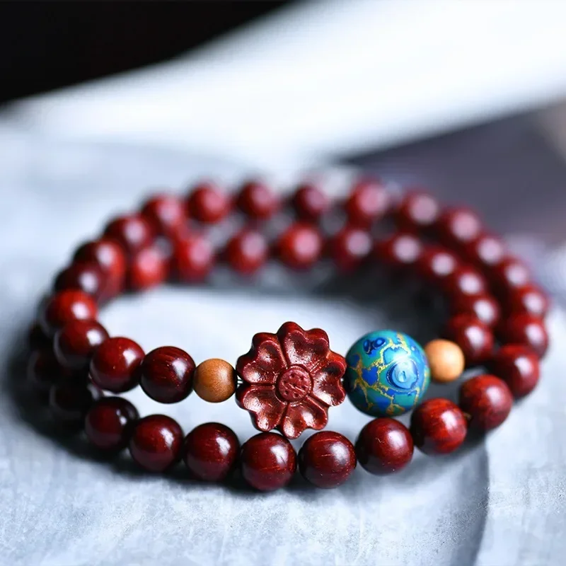 

Factory Direct Sales India Pterocarpus Santalinus 8mm Two Circles Bracelet with Big Paint Spacer Beads Ro