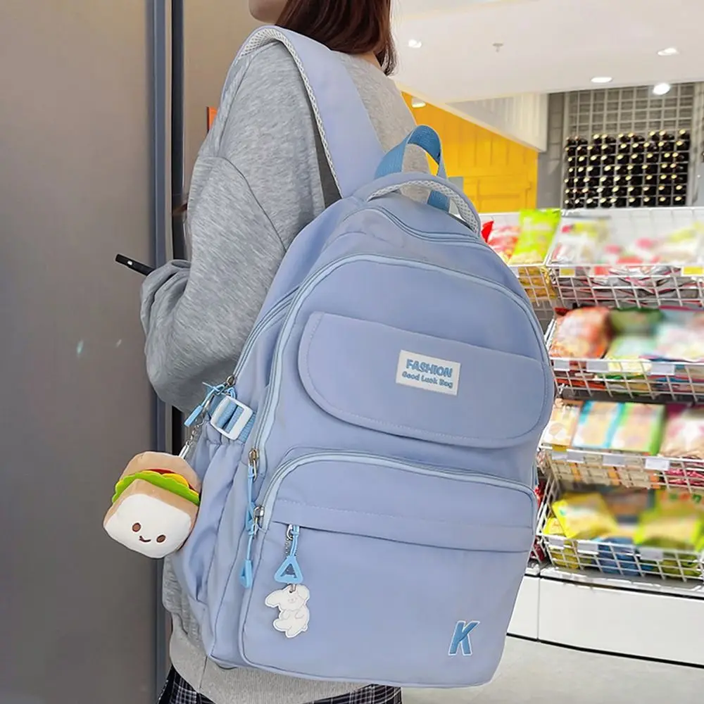 

Korean Students School Bags Lightweight Waterproof College Student Backpack Large Capacity Zipper Closure Cartoon Shoulder Bag