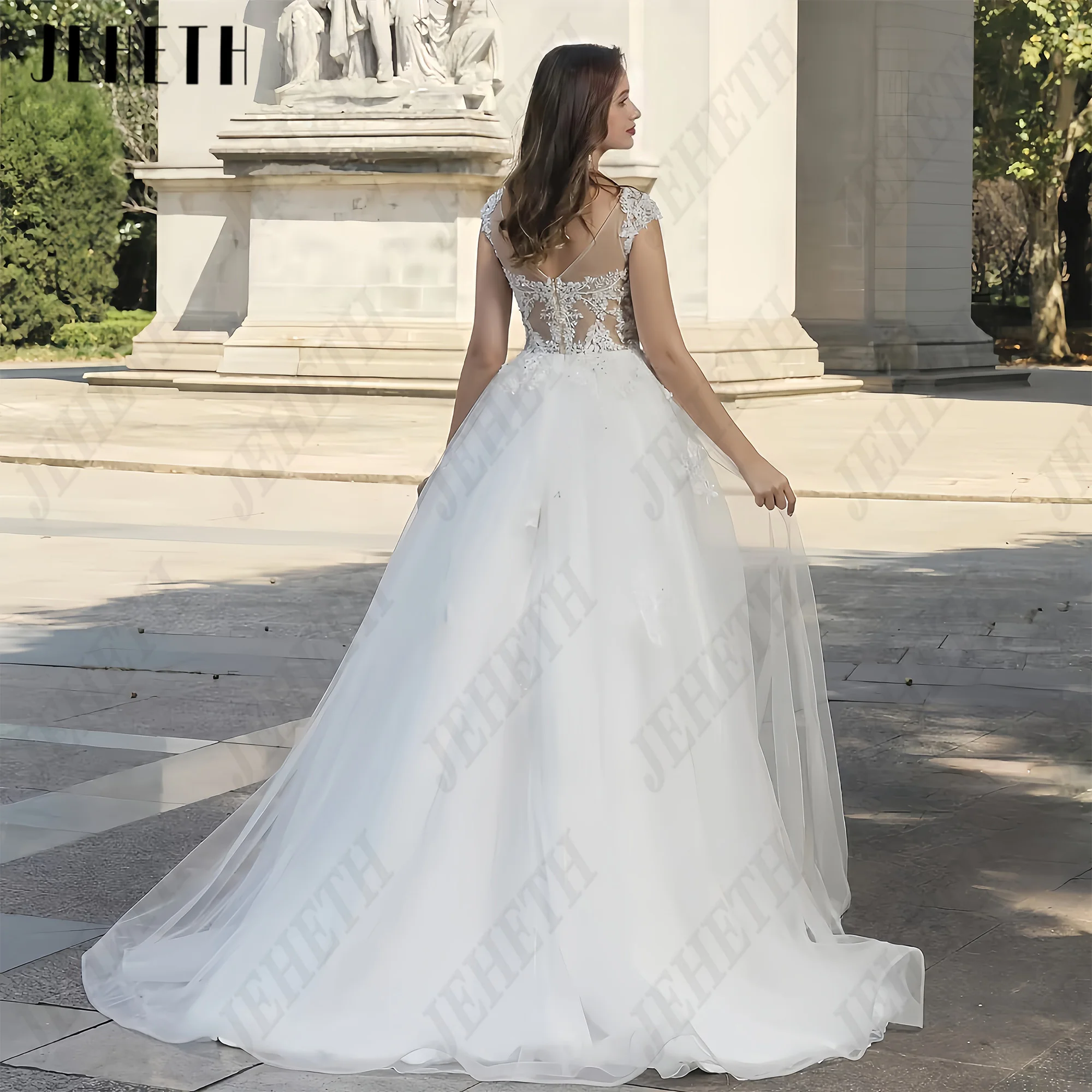 JEHETH A-line senza maniche Scoop Tulle Abito da sposa Decalcomania del pizzo Backless Lussuoso abito da sposa sexy Vestido 2025 Personalizzato JEHETH A-linea senza maniche Scoop Tulle abito da sposa pizzo decal senza