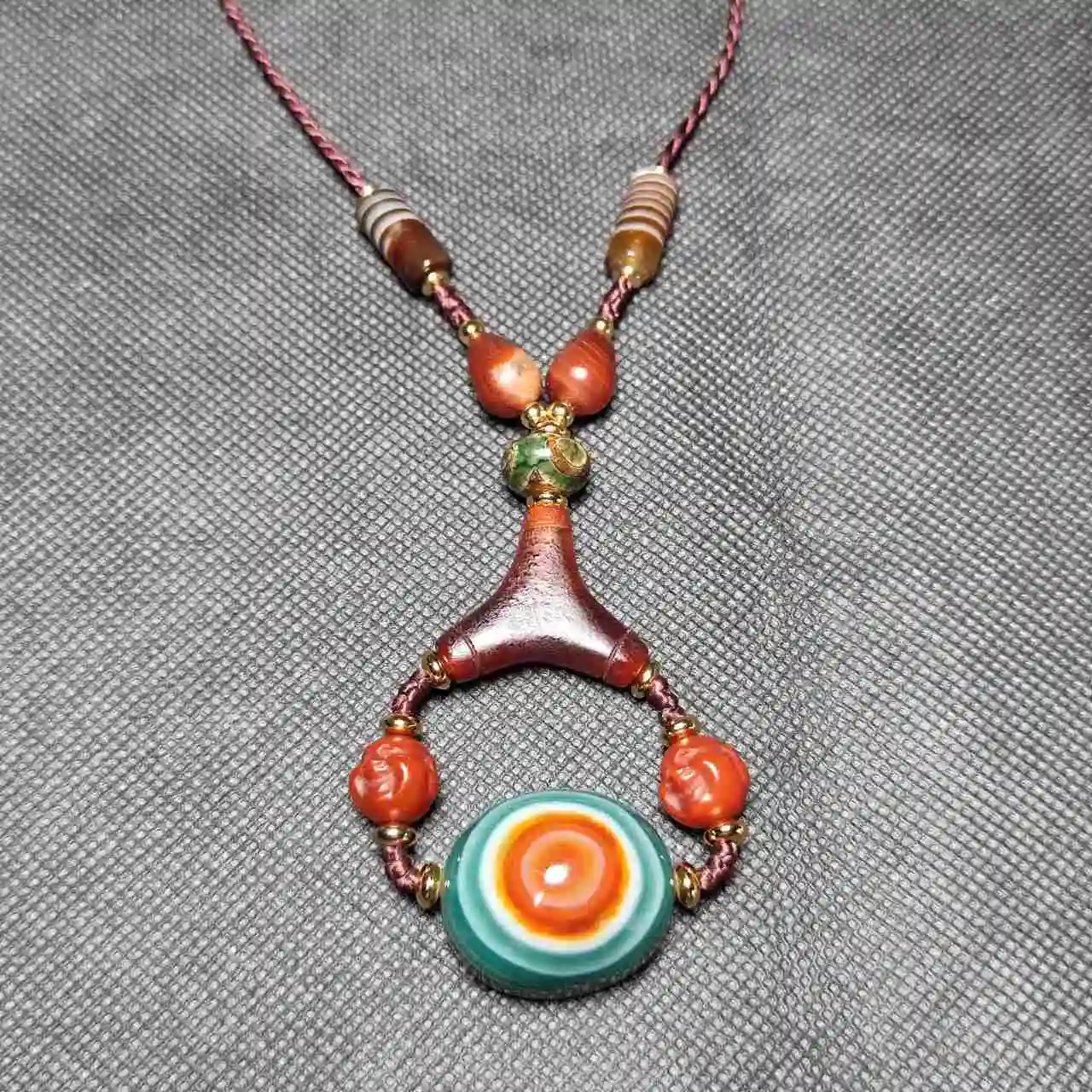 

Tibetan jewelry: Natural Agate Sheep plate eye, Sky eye Tianzhu Dzi with Maitreya Buddha head Wen play Adjustable Necklace