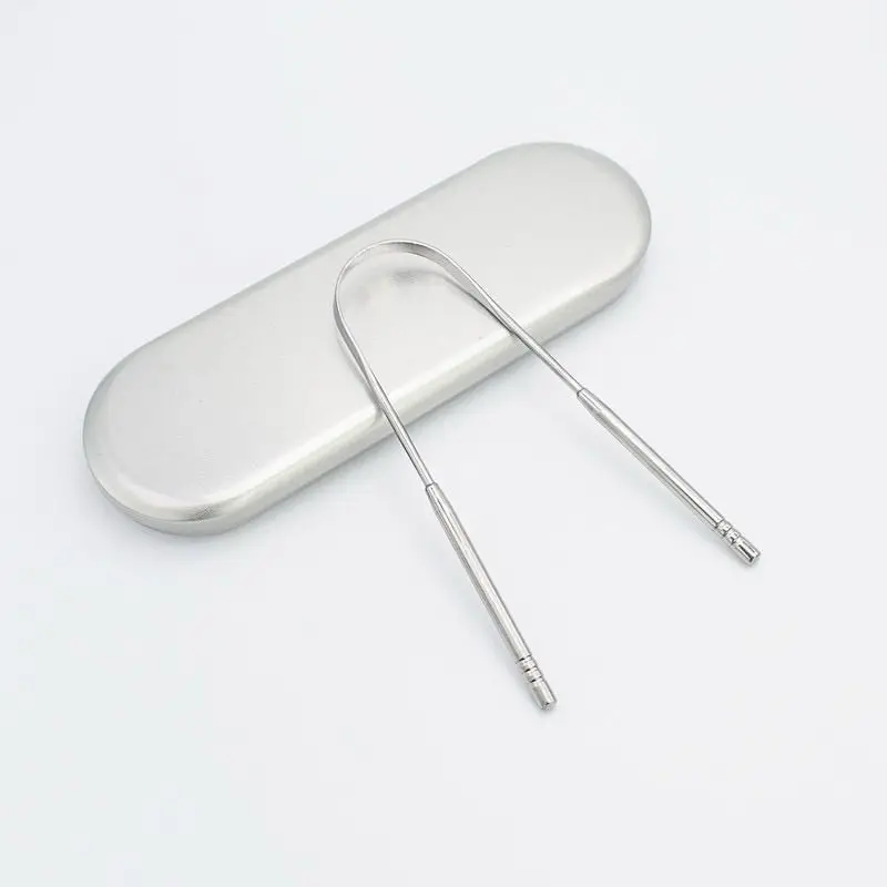 Stainless steel tongue scraper with storage box; removes bad breath, provides oral care, and freshens breath.