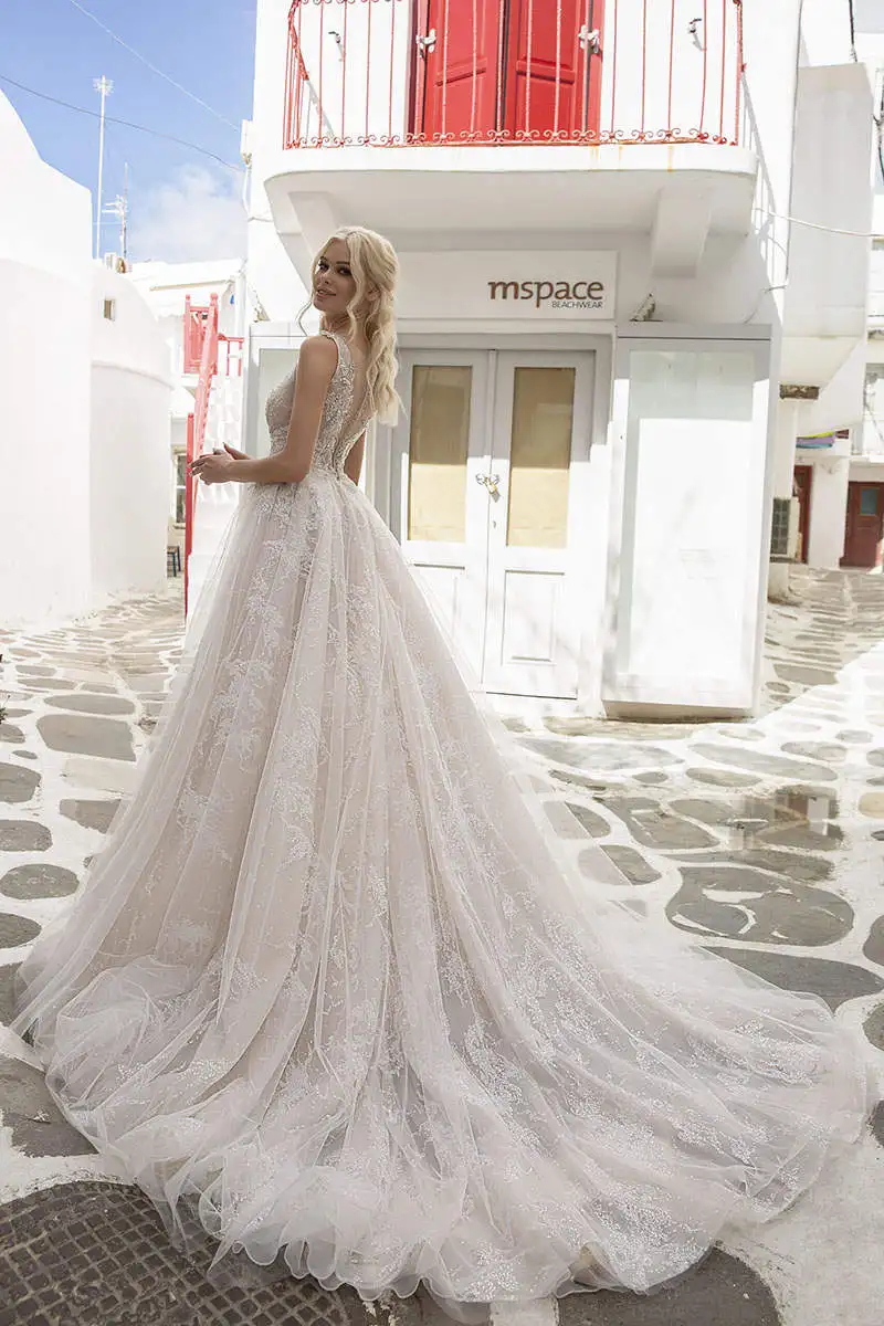 Abiti da sposa eleganti a linea A maniche lunghe Perline Paillettes Appliques Abiti da sposa in pizzo con bottoni personalizzati sul retro