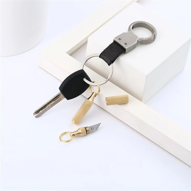 Ferramentas multifuncionais portáteis EDC Mini chaveiro ao ar livre Peel Fruits Keychain Forma de cápsula Faca de bronze Ferramentas de