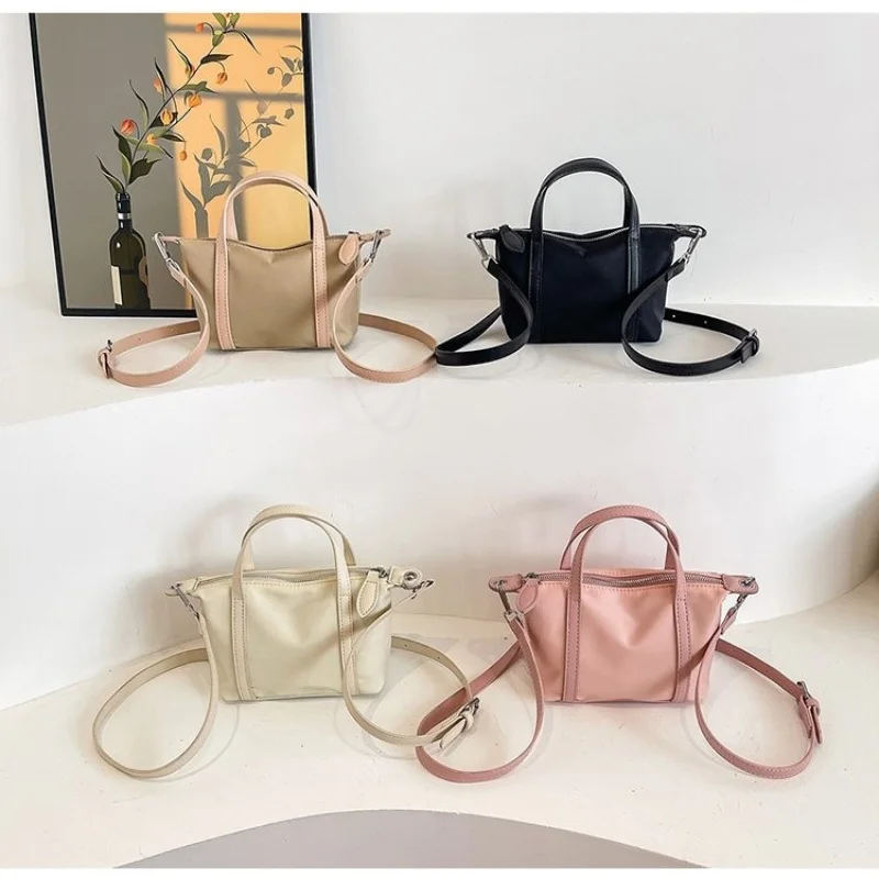 

The New Mini Dumpling Crossbody Handbag is Fashionable and Simple Made of Nylon Material with 2 Adjustable Shoulder Straps