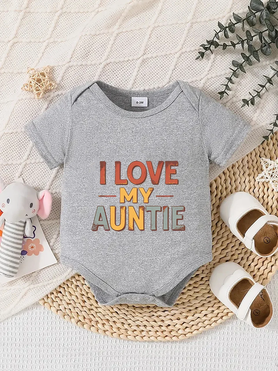 

Playful letter-printed baby short-sleeve triangle bodysuit. Button closure for easy dressing, machine washable