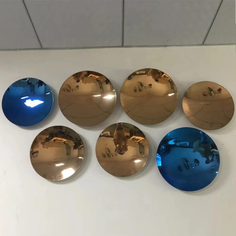 Modern spray-painted blue and gold round pieces for wall art decoration
