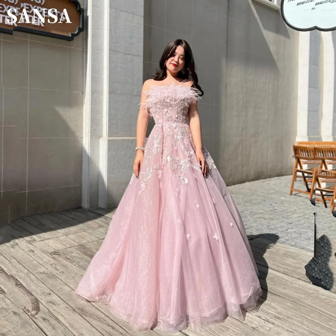 Sansa Gliiter Ball Gown فساتين سهره فاخره 2023 Shiny Light Pink فساتين السهرة Luxury Feather Neckline Prom Dresses