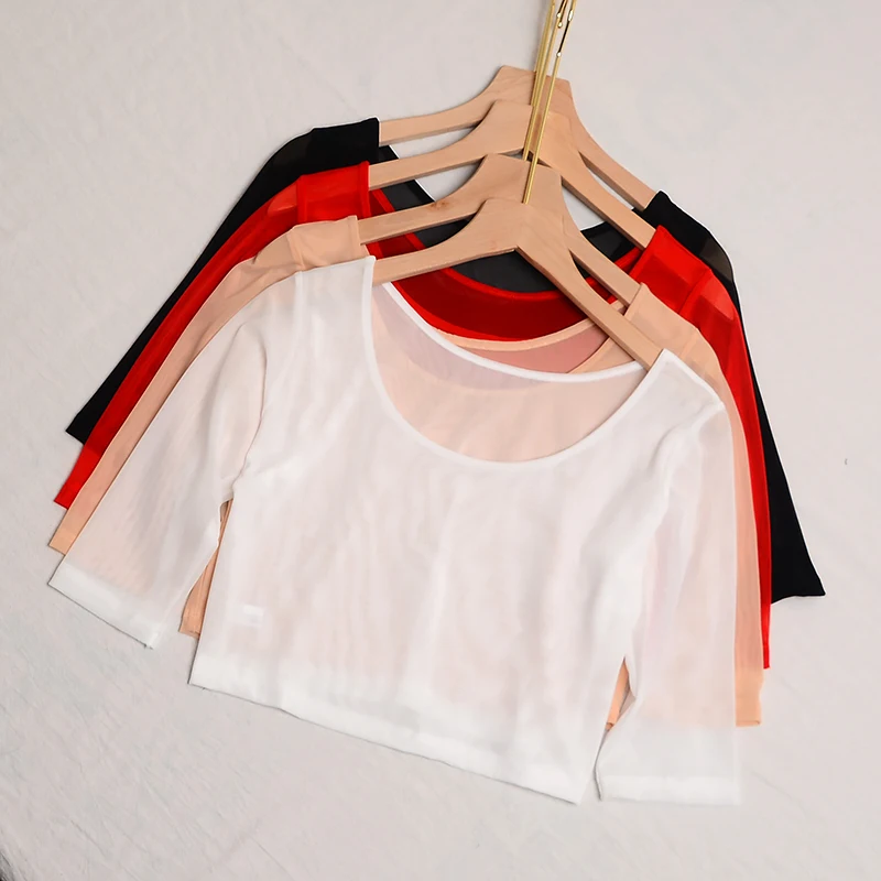 Damska koszulka na wiosnę i lato, dopasowany krój, okrągły dekolt, koronkowe wycięcia, długość do kolan, jednolity kolor.