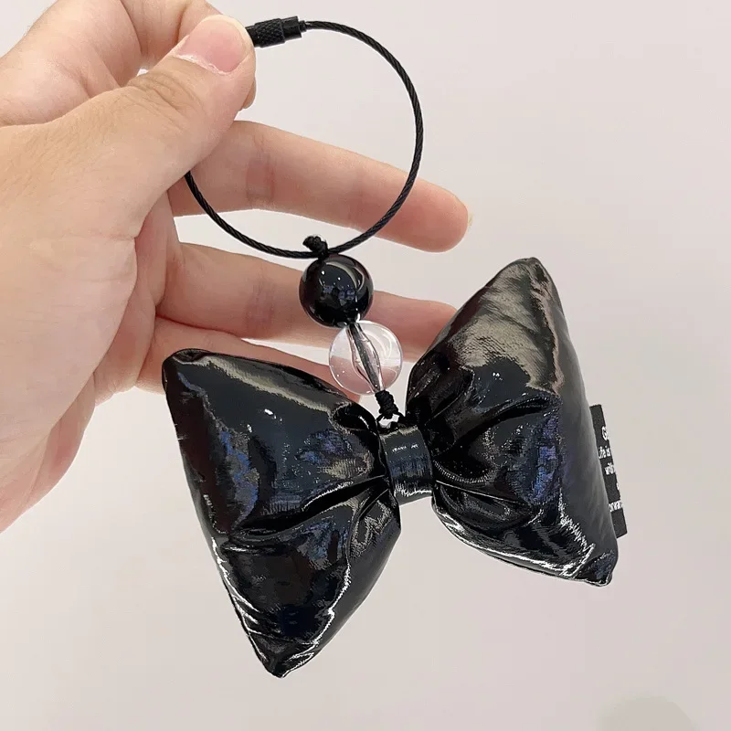 Nuevo Dongdaemun nyunyu de Corea del Sur, lazo de charol, cadena para teléfono móvil, colgante, llavero, bolso, colgante, cadena para coche